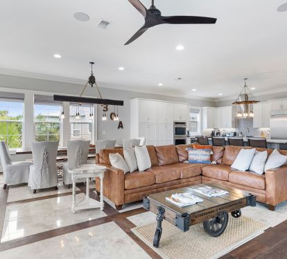 Living room has soft leather sectional