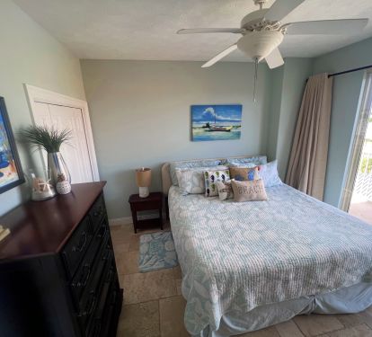 Guest bedroom 2 with King Bed, Smart TV, DVD player and balcony access