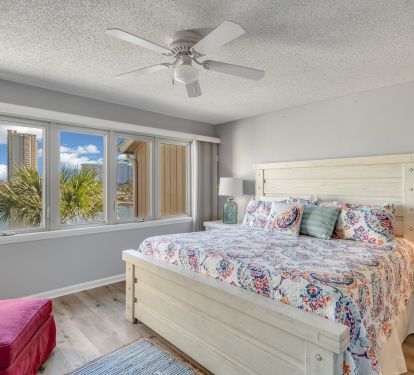 Master bedroom has expansive view of lake