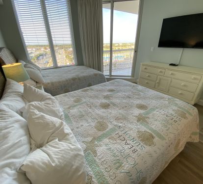 Bedroom 3-  Balcony with city views and 50 inch HD Tv.