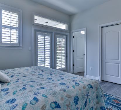 Main floor bedroom, king bed, balcony with view of gulf