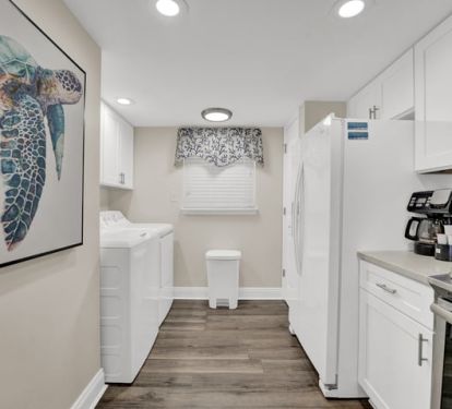 Galley style kitchen with lots of lighting.