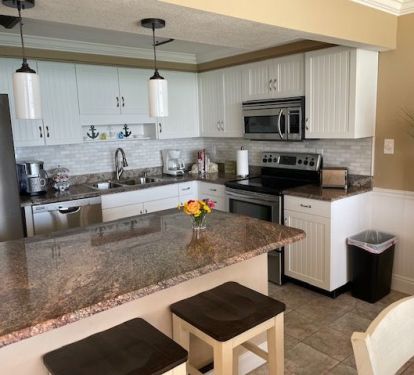 Kitchen updated with new tile backsplash. 