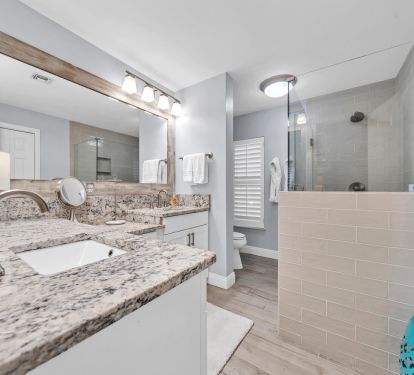 Recently renovated primary bath with shower and bench seating