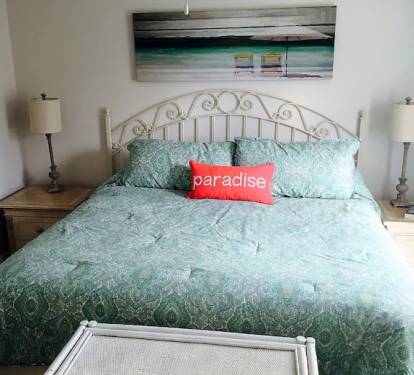 Spacious master bedroom upstairs has a spa-like feel &amp; a comfortable king bed.