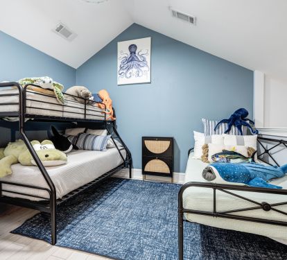 Open Loft sleeping area with bunk beds and daybeds&mdash;perfect for kids or extra guests, with toys to keep everyone entertained.