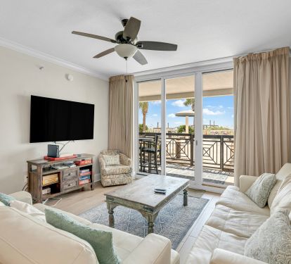 Spacious living area with natural light and direct patio access