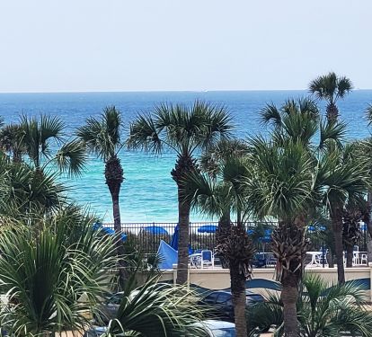 Great gulf view . Blue umbrellas are at the gulffront pool