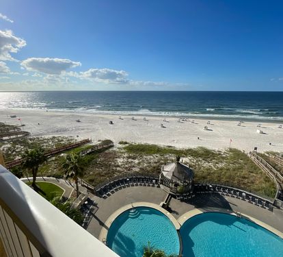 View out to the balcony &amp; beach. Chairs &amp; umbrella service available.