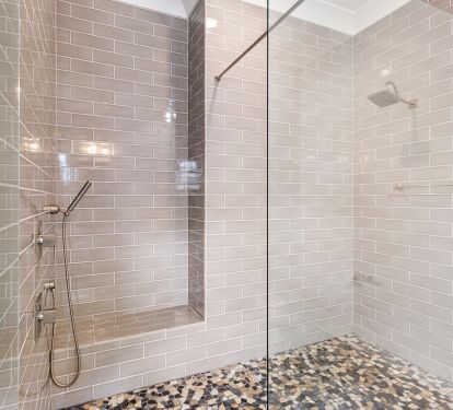 All bathrooms (except bunk bathroom) have glass shower doors