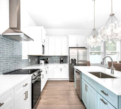 Azure-13 Create your culinary masterpieces in Azure's new kitchen, featuring stainless appliances with quartz counters and subway tile backsplash.