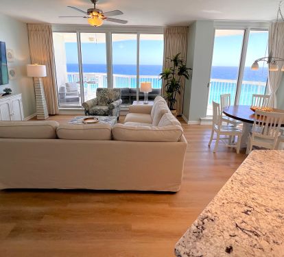 Living, dining and kitchen area filled with floor to ceiling ocean views!