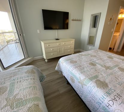 Bedroom 3- Features a private full bath, balcony access and 50 inch HD Tv.