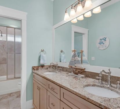 Shenanigans-20..2nd floor common area bath with double granite vanity and tub/shower.