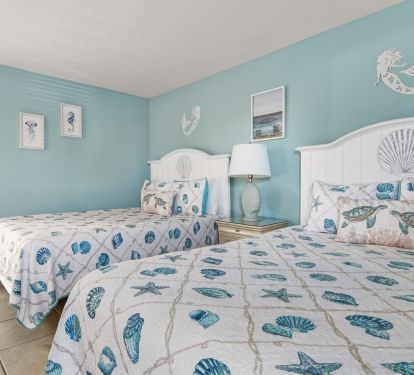 Spacious second bedroom with two queen beds. 