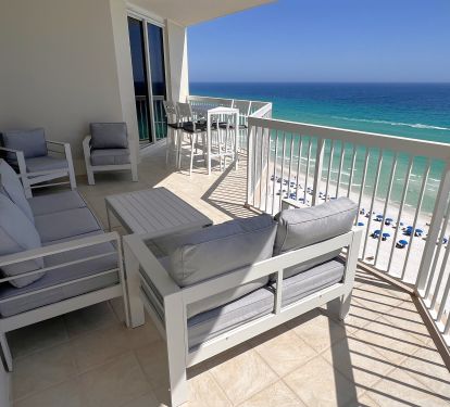 Large ocean front balcony with outdoor sofa, loveseat and 2 chairs seats seven!