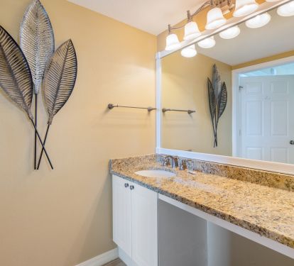 The master bathroom also has a separate vanity with sitting area