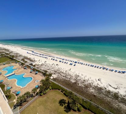 Actual view from our balcony of the private beach, 2 large pools &amp; 2 hot tubs.
