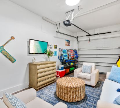 Garage Equipped with a TV, PacMan System, Beach Chairs, Toys, &amp; Coolers.