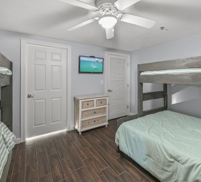 Bunk room with Twin over Queen and Twin over twin with trundle. Flat screen TV
