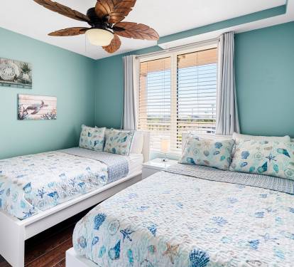 second bedroom with two full sized beds