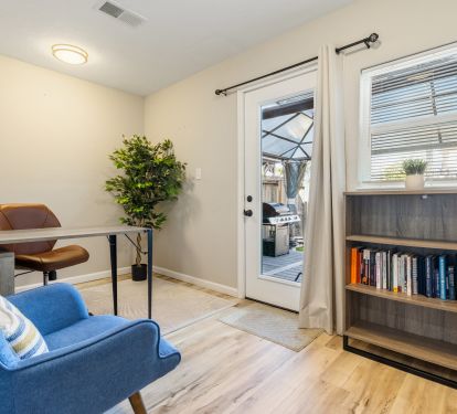 Office space with computer desk, chairs and books for you to focus on work/study