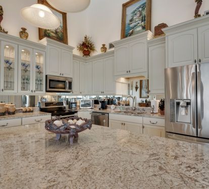 Kitchen with top-of-the-line cabinets, slow close drawers and high-end granite