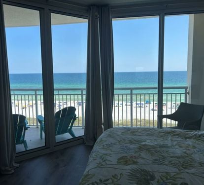 Master bedroom with king size bed and view -