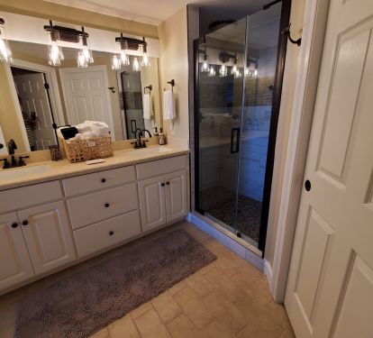 Master bath has double sinks,dual headed shower,separate toilet, &amp; large closet.