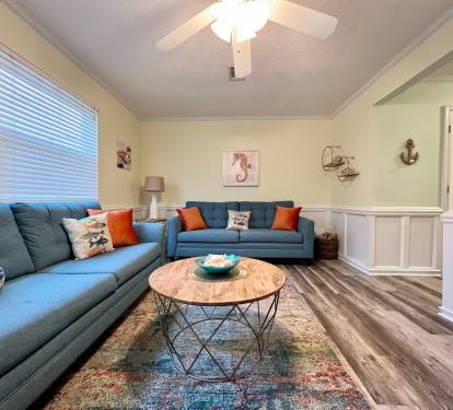 The living room offers 2 full size couches. One of them is a queen sleeper sofa.