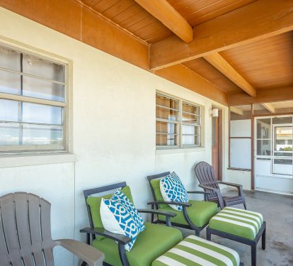 Screened in porch with comfortable seating