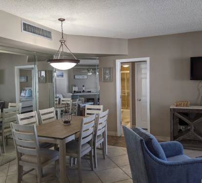 Dining area seats 6, entrance into guest bedroom and bath