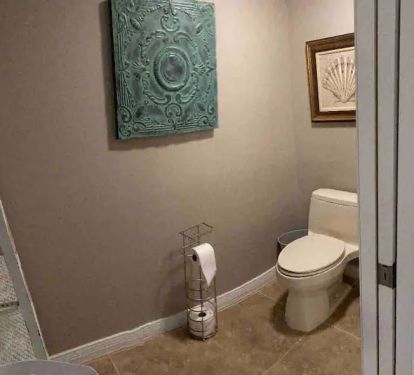 Here is the attached toilet room located in the master bathroom.
