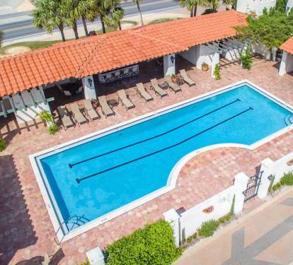 Beautiful pool for swimming laps and relaxing in the sun. The pool has bathrooms, a small kitchen and tables.