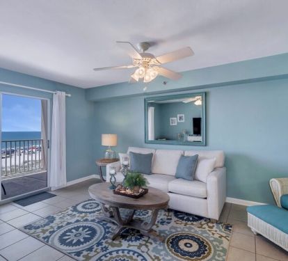 Spacious Living Room with views of the Beautiful Gulf of Mexico and access to Private Balcony and Full Size Sleeper Sofa