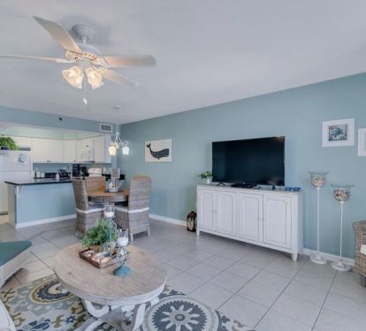 Spacious Living Area with Full Size Sleeper Sofa and Cozy Dining Table for 4