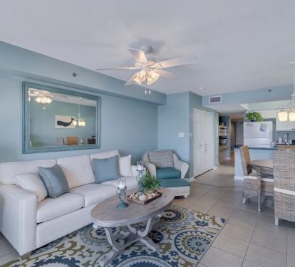 Spacious Living Area with views of the Beautiful Gulf of Mexico and access to Private Balcony and Full Size Sleeper Sofa