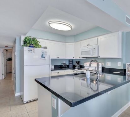 Beautifully Updated Kitchen with Granite Countertops and views of the Gulf
