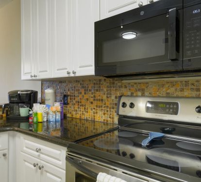 Granite countertops, stainless appliances, and thoughtful coastal details create a welcoming space that feels like your home by the sea.