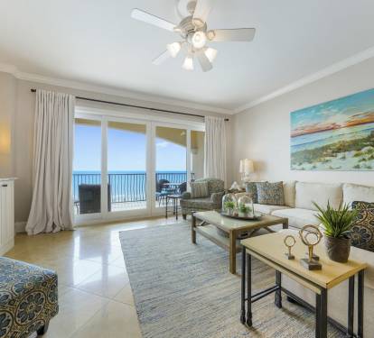 Large, Open Living Space with Gulf Views, Balcony Access, and comfortable seating around a 70" Smart TV!