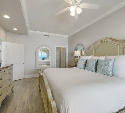 Relaxing beachfront king bedroom with natural light and private entry to the oceanfront balcony
