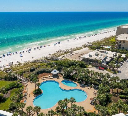 From above, you can see exactly why guests love Crescent 110. A lagoon style beachfront pool, private beach access, and endless coastline just steps away.