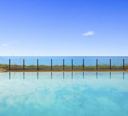 Nothing says R & R more than an infinity pool by the beach!