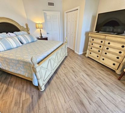 Master bedroom with large flat screen TV