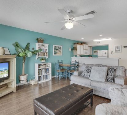 Open Living Room & Kitchen with flat-screen TV