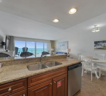 Cabana Club 205 open living space with kitchen, dining, and ocean views
