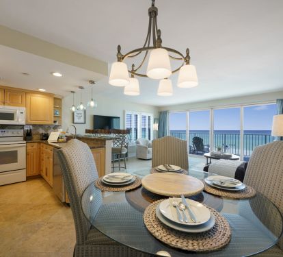 The open dining and kitchen layout makes this beachfront rental perfect for family vacations and entertaining.