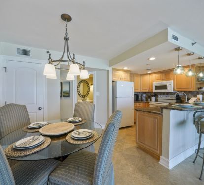 Dine comfortably at the glass top table or enjoy casual meals at the breakfast bar in this Gulf front Destin condo