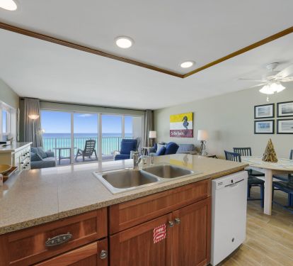 Open kitchen with Gulf-front living area at Cabana Club 301
