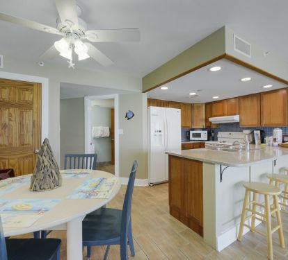 Bright dining area with breakfast bar seating
